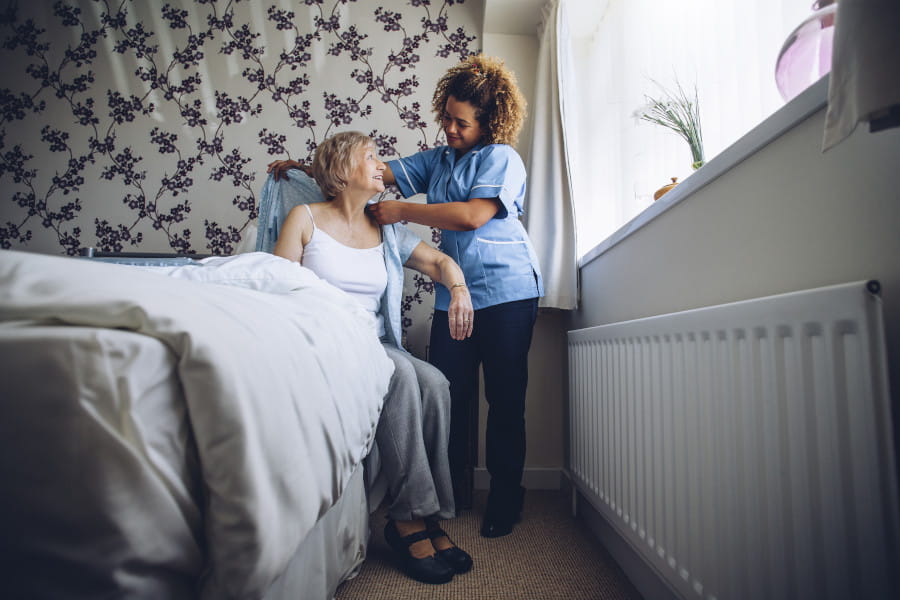 Nurse helping elderly